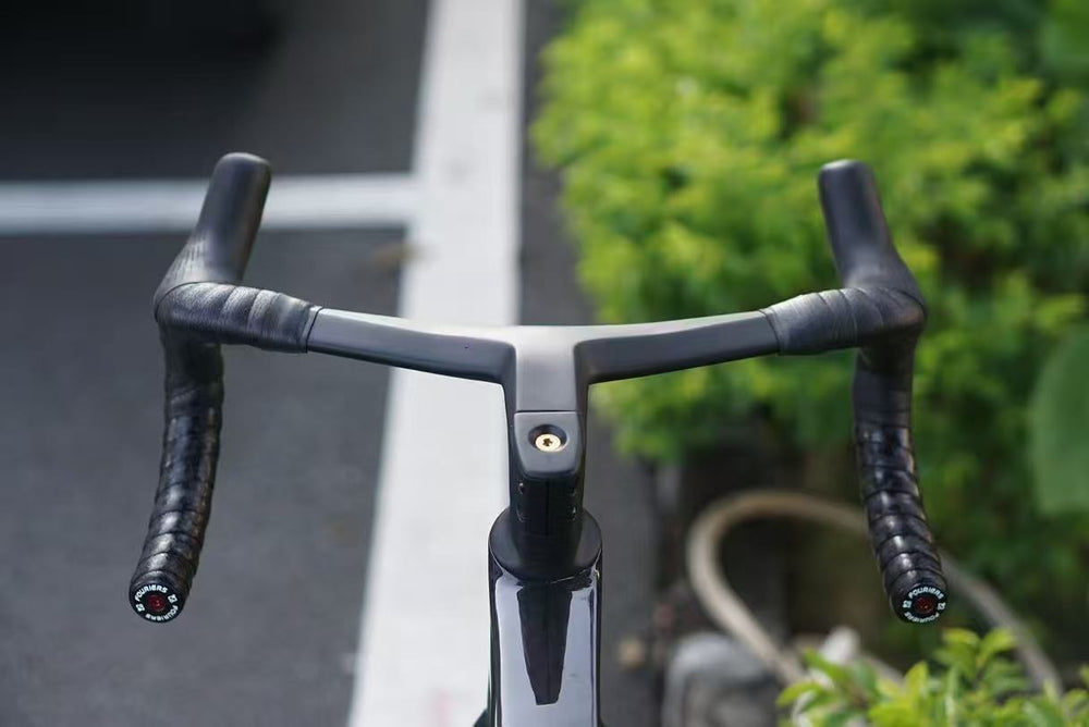 TOCCAY integrated carbon road handlebar photographed installed outdoors, front view