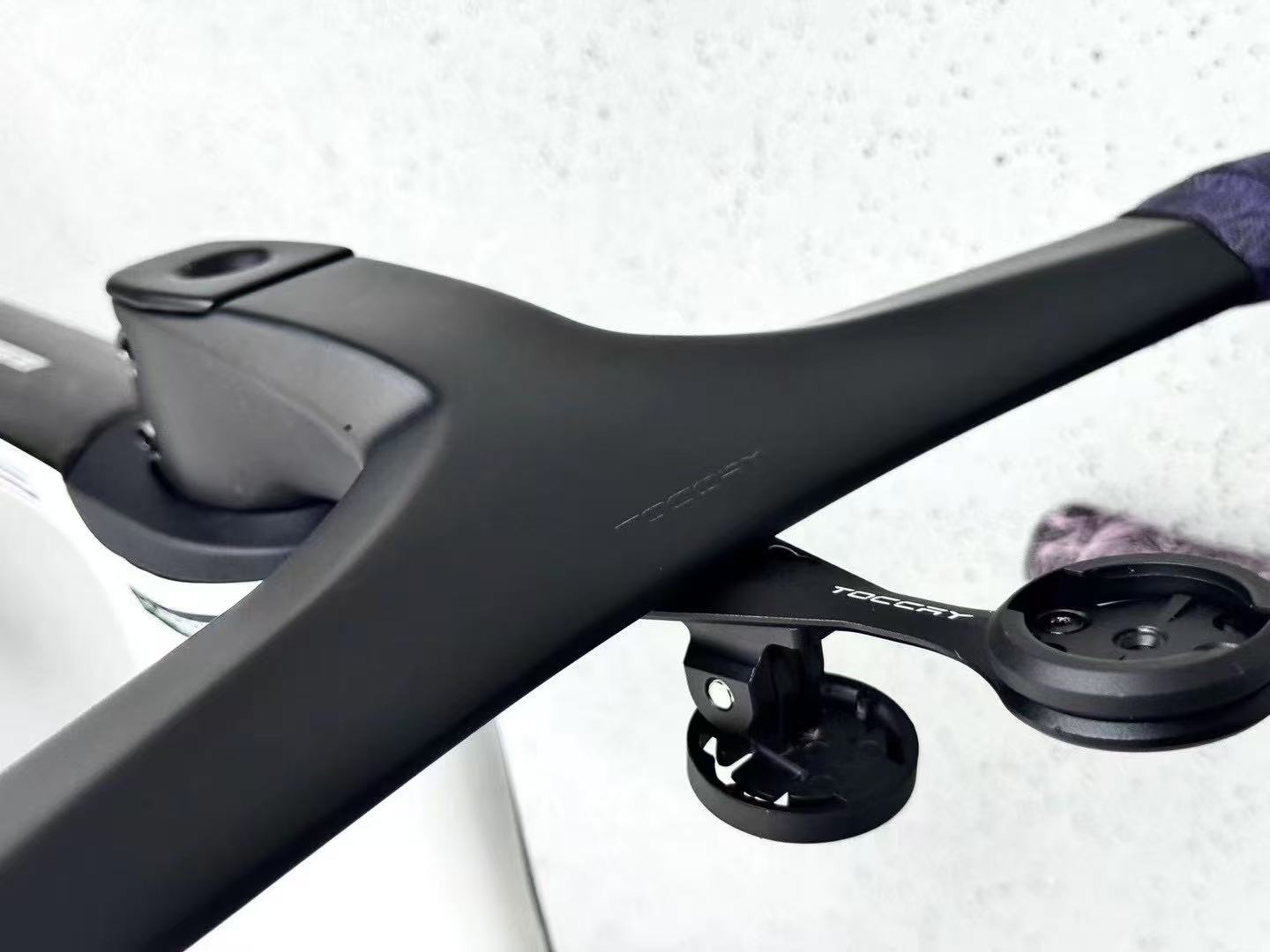 Close up of TOCCAY out-front computer mount on integrated carbon cockpit