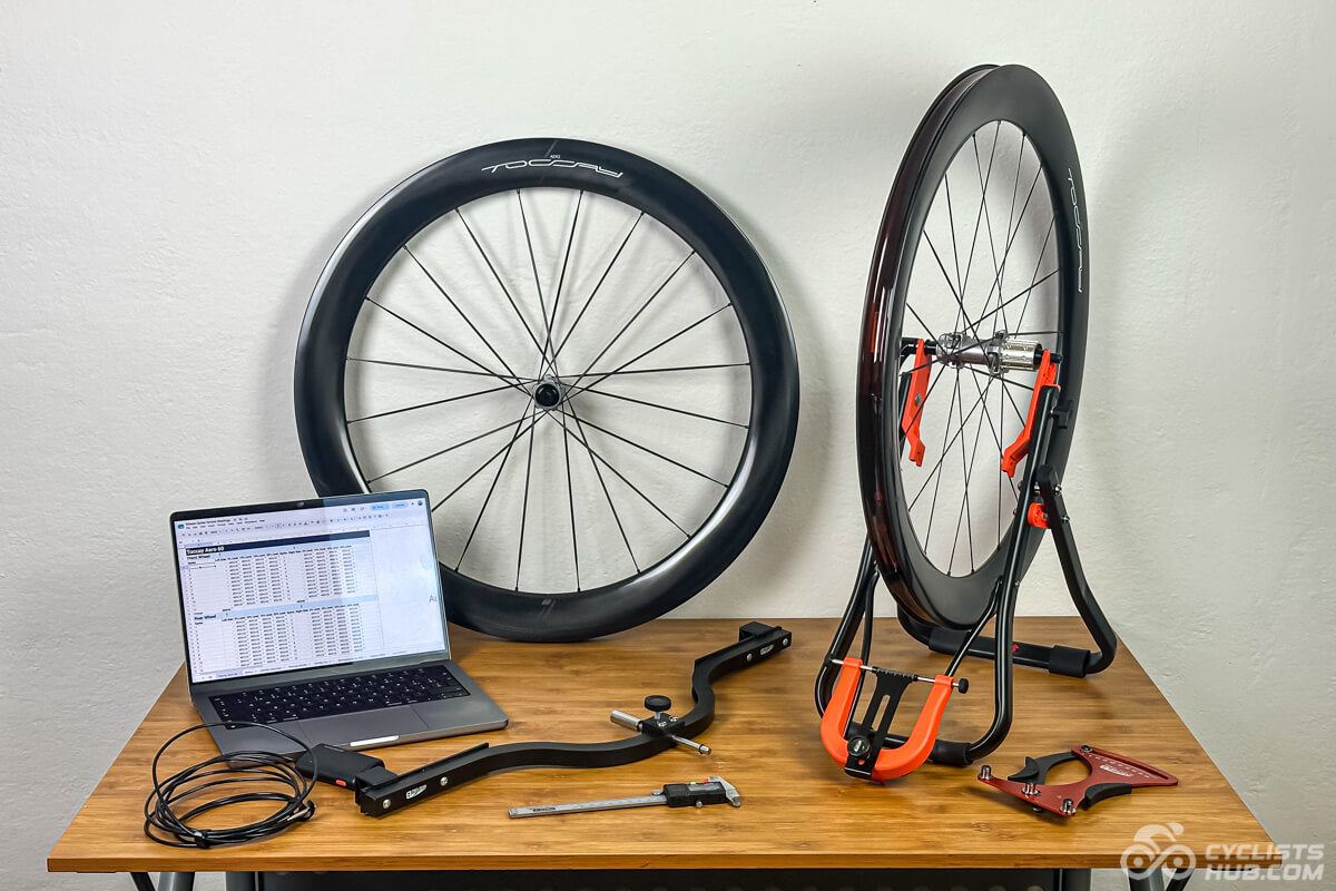 AERO-60 wheels on the Cyclists Hub test bench with a truing stand and measuring tools